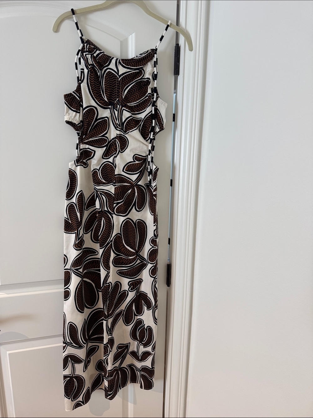 La Ligne Sleeveless White Dress with Brown Floral Print and cutout waist detail.